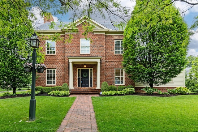 4477 Ackerly Farm Rd, New Albany, OH 43054 - colonial inspired home with a front lawn and brick siding