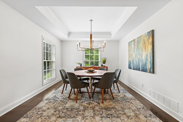 4477 Ackerly Farm Rd, New Albany, OH 43054 - dining area with a chandelier, a raised ceiling, crown molding, dark wood-style floors, and baseboards