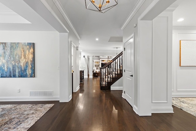 4477 Ackerly Farm Rd, New Albany, OH 43054 - entrance foyer featuring stairs, a chandelier, dark wood-type flooring, baseboards, and crown molding