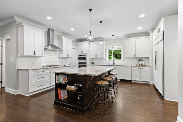 4477 Ackerly Farm Rd, New Albany, OH 43054 - kitchen featuring wall chimney exhaust hood, dishwashing machine, a center island, white cabinets, and recessed lighting