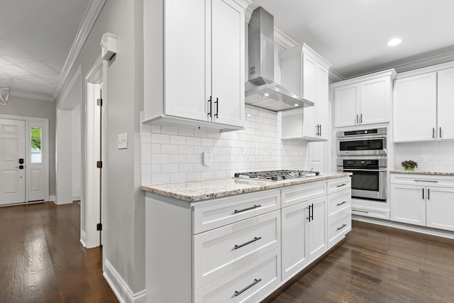 4477 Ackerly Farm Rd, New Albany, OH 43054 - kitchen with wall chimney range hood, stainless steel appliances, dark wood finished floors, white cabinets, and tasteful backsplash