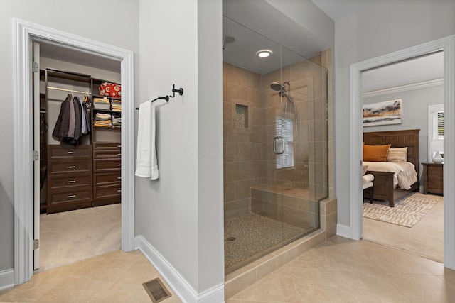 4477 Ackerly Farm Rd, New Albany, OH 43054 - full bath featuring baseboards, a shower stall, ensuite bath, tile patterned floors, and crown molding