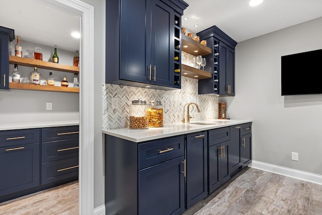 4477 Ackerly Farm Rd, New Albany, OH 43054 - indoor wet bar featuring light wood-type flooring, decorative backsplash, baseboards, and recessed lighting