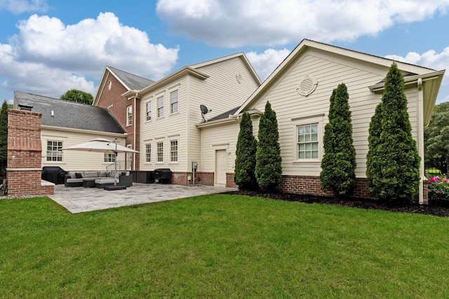 4477 Ackerly Farm Rd, New Albany, OH 43054 - back of property with outdoor lounge area, a patio area, and a lawn