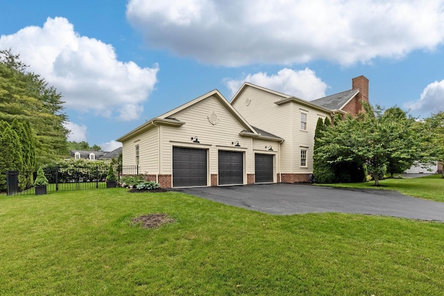 4477 Ackerly Farm Rd, New Albany, OH 43054 - view of side of property with driveway, a chimney, and brick siding