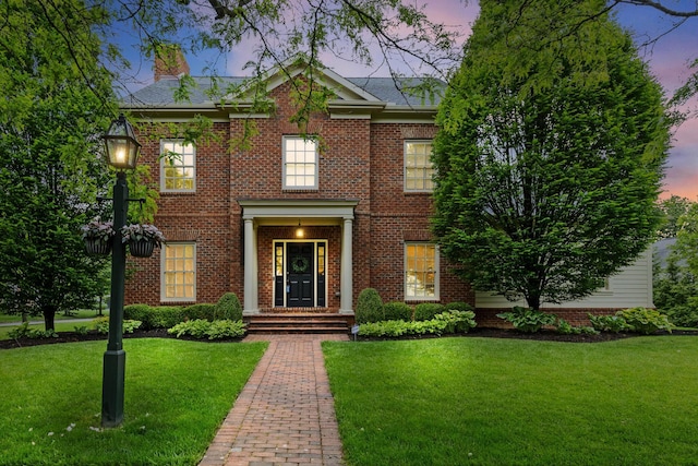 4477 Ackerly Farm Rd, New Albany, OH 43054 - colonial inspired home featuring a lawn, a chimney, and brick siding
