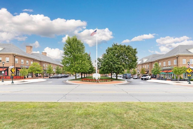 4477 Ackerly Farm Rd, New Albany, OH 43054 - view of asphalt street with traffic signs, curbs, sidewalks, and street lights