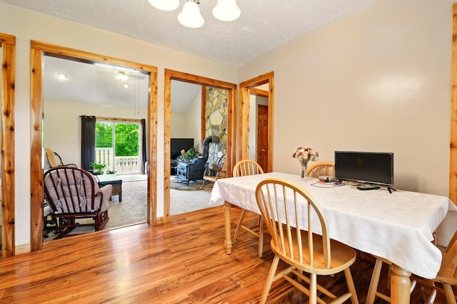 19160 Coshocton Rd, Mount Vernon, OH 43050 - dining room with wood finished floors, a chandelier, and a textured ceiling