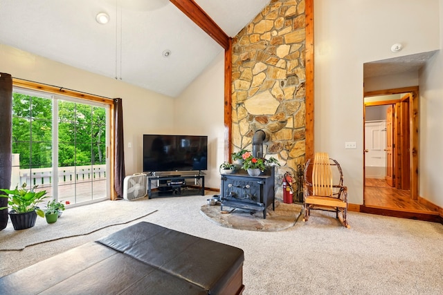 19160 Coshocton Rd, Mount Vernon, OH 43050 - carpeted living area with a wood stove, high vaulted ceiling, beam ceiling, and baseboards