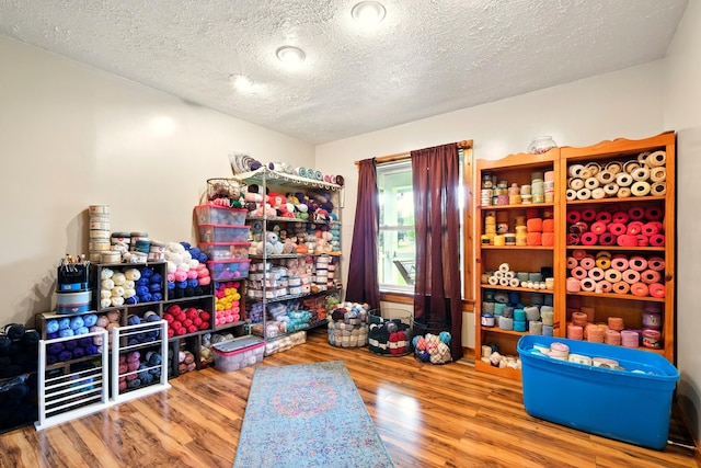 19160 Coshocton Rd, Mount Vernon, OH 43050 - miscellaneous room featuring wood finished floors and a textured ceiling