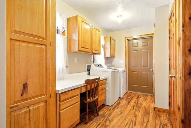 19160 Coshocton Rd, Mount Vernon, OH 43050 - laundry area with cabinet space, an office area, light wood-style floors, washer and dryer, and a textured ceiling