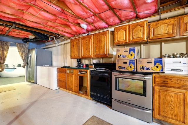 19160 Coshocton Rd, Mount Vernon, OH 43050 - kitchen featuring range, concrete floors, refrigerator, brown cabinetry, and freestanding refrigerator