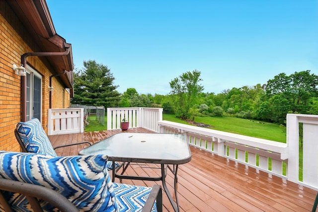 19160 Coshocton Rd, Mount Vernon, OH 43050 - deck with view of wooded area, outdoor dining area, and a lawn