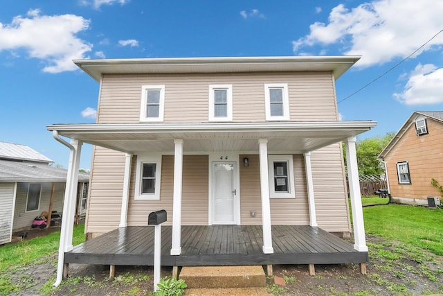 44 W 4th St, Fredericktown, OH 43019 - view of front of property featuring covered porch and a front lawn