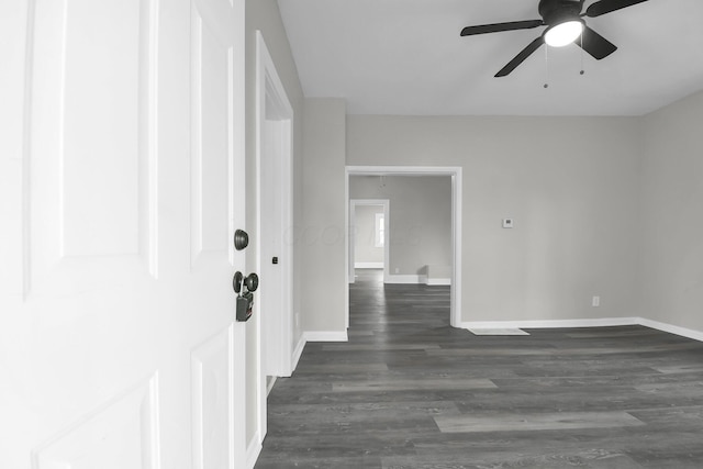 44 W 4th St, Fredericktown, OH 43019 - foyer with baseboards, ceiling fan, and dark wood-style flooring