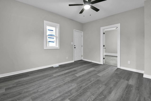 44 W 4th St, Fredericktown, OH 43019 - empty room with ceiling fan, dark wood-style flooring, and baseboards
