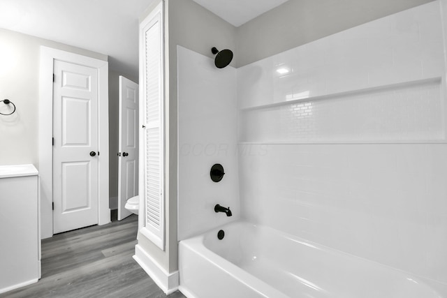 44 W 4th St, Fredericktown, OH 43019 - full bath featuring shower / washtub combination, toilet, wood finished floors, and a closet