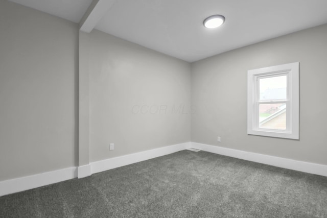 44 W 4th St, Fredericktown, OH 43019 - unfurnished room with dark colored carpet, baseboards, and beam ceiling