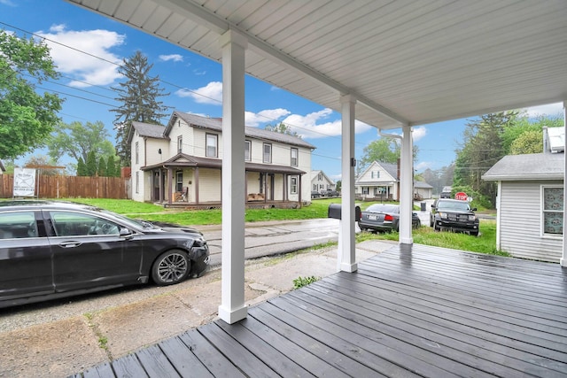 44 W 4th St, Fredericktown, OH 43019 - wooden porch with a residential view