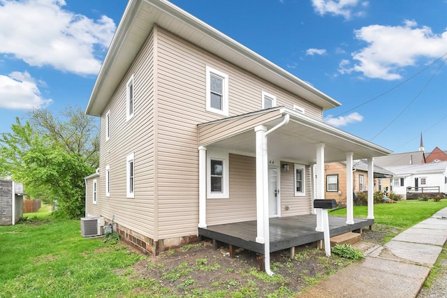 44 W 4th St, Fredericktown, OH 43019 - view of front of home with a front lawn, cooling unit, and a porch