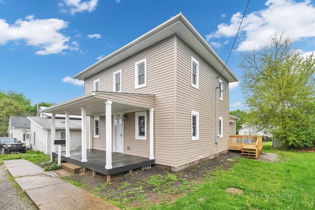 44 W 4th St, Fredericktown, OH 43019 - view of front of property with a front lawn and a deck