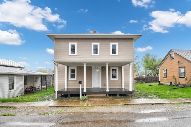 44 W 4th St, Fredericktown, OH 43019 - view of front of property featuring a porch and a front yard