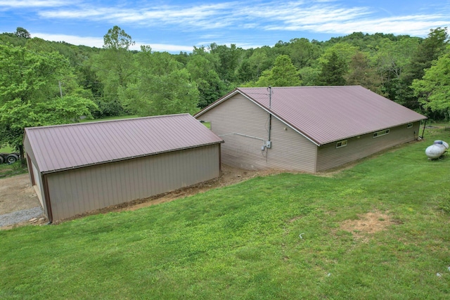 2149 Baptist Hill Rd, Chillicothe, OH 45601 - view of pole building featuring a yard and a wooded view