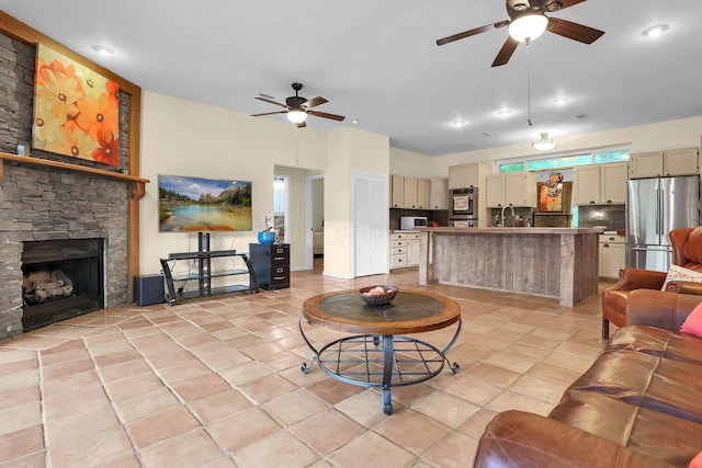 2149 Baptist Hill Rd, Chillicothe, OH 45601 - living room with a ceiling fan, light tile patterned flooring, and a stone fireplace