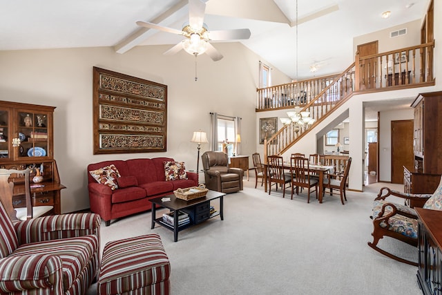 4995 Softwood Ct, Westerville, OH 43081 - carpeted living area featuring stairway, ceiling fan, and high vaulted ceiling