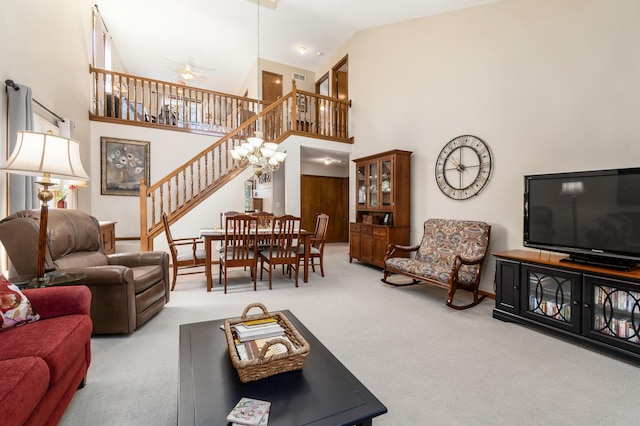 4995 Softwood Ct, Westerville, OH 43081 - living room with carpet floors, stairway, high vaulted ceiling, and ceiling fan