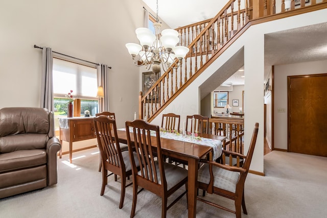 4995 Softwood Ct, Westerville, OH 43081 - dining room with light colored carpet, stairway, a chandelier, a high ceiling, and baseboards