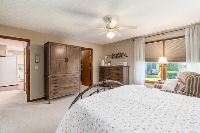 4995 Softwood Ct, Westerville, OH 43081 - bedroom with freestanding refrigerator, light colored carpet, a ceiling fan, baseboards, and a textured ceiling