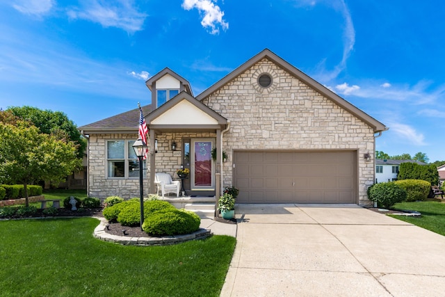 4995 Softwood Ct, Westerville, OH 43081 - view of front of property featuring stone siding, concrete driveway, a front yard, and an attached garage