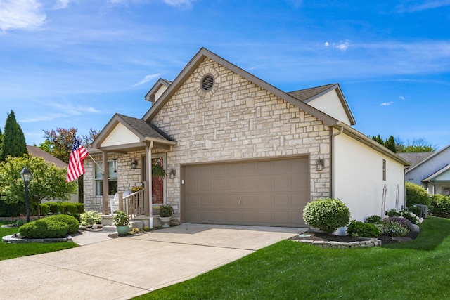 4995 Softwood Ct, Westerville, OH 43081 - view of front of house with stone siding, an attached garage, driveway, stucco siding, and a front yard