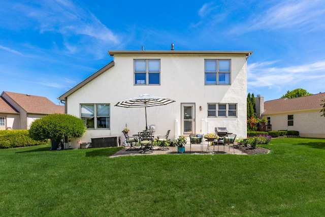 4995 Softwood Ct, Westerville, OH 43081 - back of house featuring stucco siding, a patio area, and a yard
