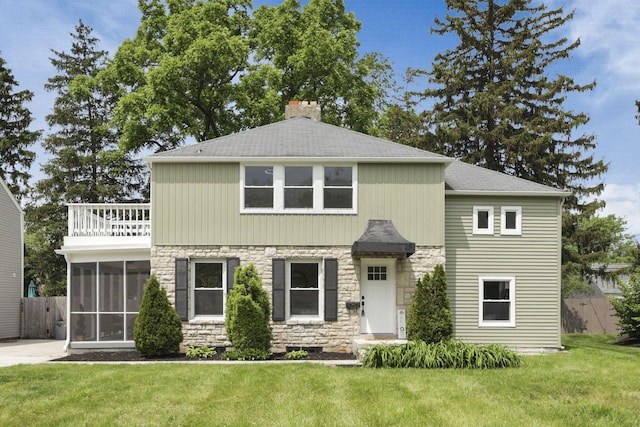 2615 NW Blvd, Upper Arlington, OH 43221 - view of front of house featuring stone siding, a sunroom, a balcony, a chimney, and a shingled roof