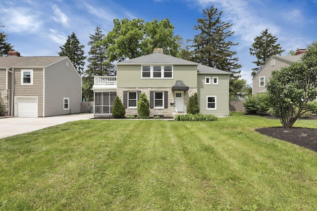 2615 NW Blvd, Upper Arlington, OH 43221 - view of front of house with a sunroom, a chimney, stone siding, and a front yard