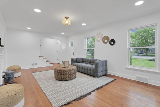 2615 NW Blvd, Upper Arlington, OH 43221 - living room featuring arched walkways, stairs, wood finished floors, recessed lighting, and baseboards