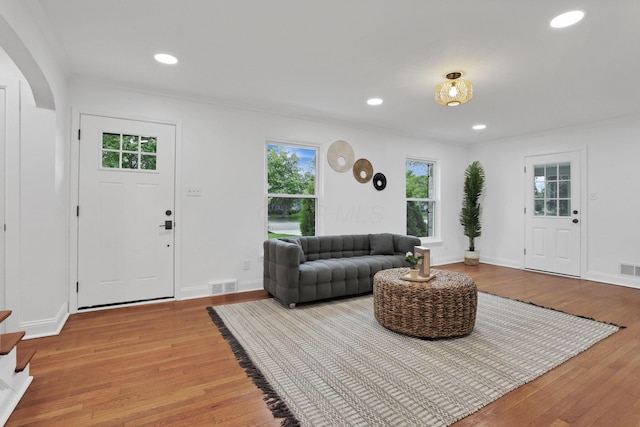 2615 NW Blvd, Upper Arlington, OH 43221 - living room with arched walkways, wood finished floors, recessed lighting, baseboards, and crown molding