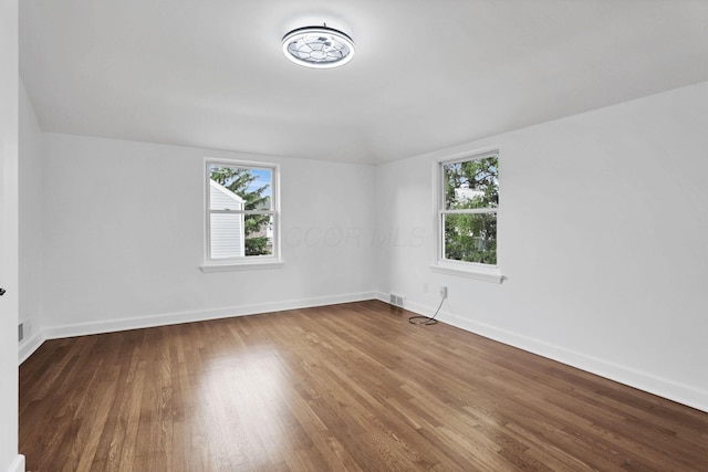 2615 NW Blvd, Upper Arlington, OH 43221 - unfurnished room featuring healthy amount of natural light, wood finished floors, and baseboards