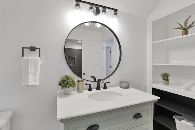 2615 NW Blvd, Upper Arlington, OH 43221 - bathroom featuring vanity, toilet, and vaulted ceiling