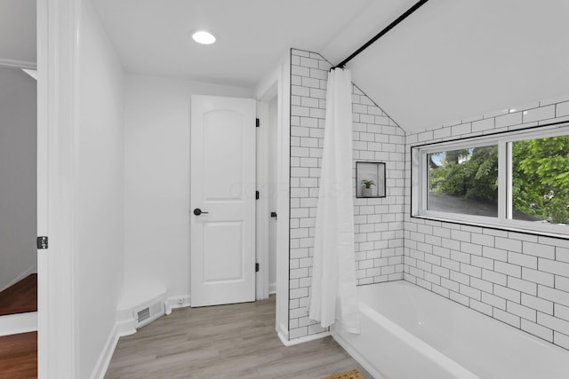 2615 NW Blvd, Upper Arlington, OH 43221 - full bathroom with wood finished floors, shower / tub combo with curtain, lofted ceiling, recessed lighting, and baseboards