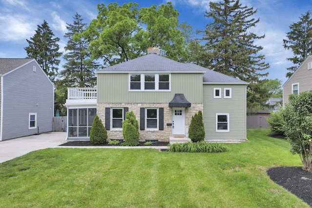2615 NW Blvd, Upper Arlington, OH 43221 - view of front facade with stone siding, a chimney, a sunroom, a shingled roof, and a balcony