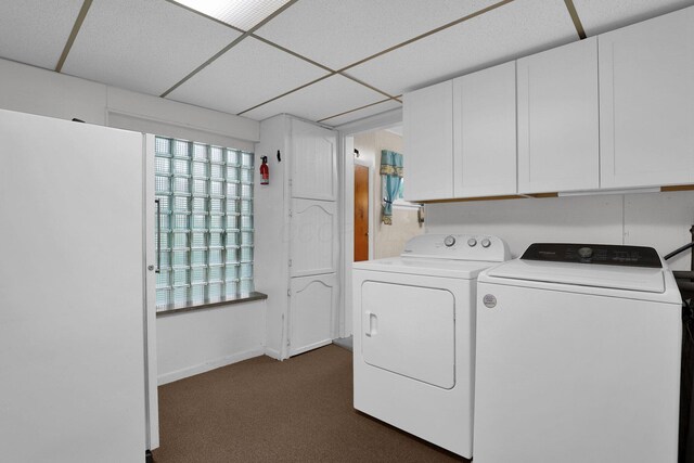 13424 Ivy Rd NE, Thornville, OH 43076 - laundry area with washer and clothes dryer, cabinet space, and dark colored carpet