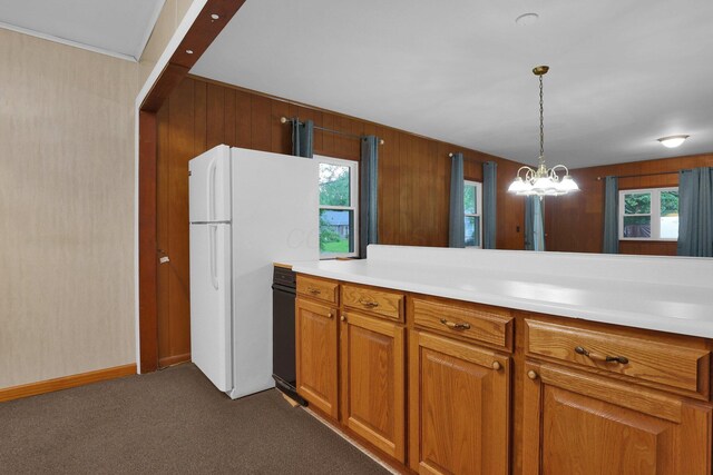 13424 Ivy Rd NE, Thornville, OH 43076 - kitchen featuring brown cabinets, dark carpet, freestanding refrigerator, light countertops, and plenty of natural light
