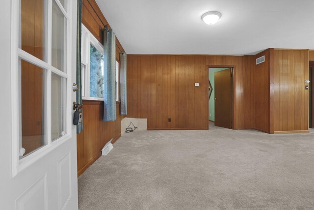 13424 Ivy Rd NE, Thornville, OH 43076 - unfurnished room with wood walls and carpet flooring