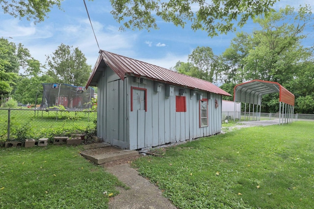 13424 Ivy Rd NE, Thornville, OH 43076 - view of outdoor structure featuring a carport and a fenced backyard