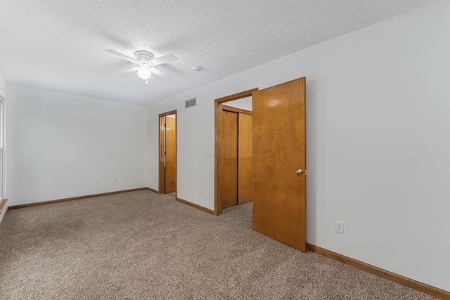 406 Olentangy Forest Dr Unit 9B, Columbus, OH 43214 - spare room featuring carpet floors, a ceiling fan, baseboards, a textured ceiling, and a smoke detector