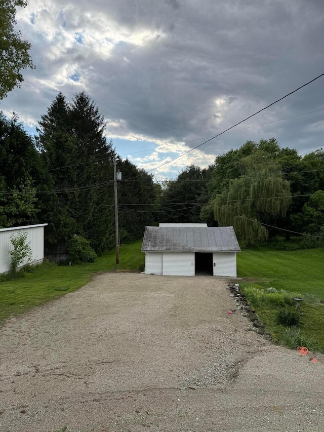 627 N Main St, Utica, OH 43080 - detached garage with a forest view