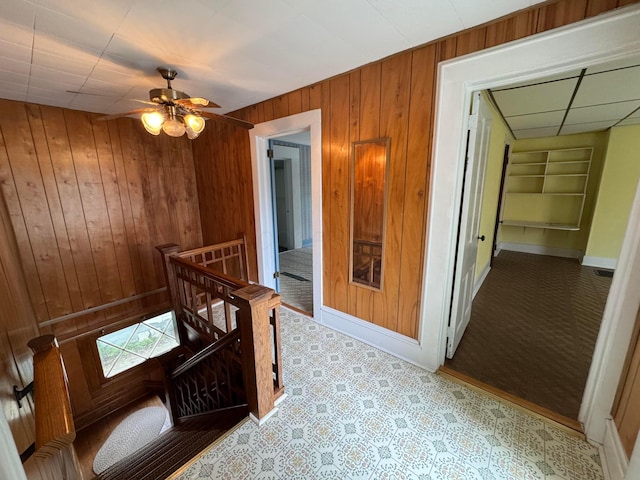 627 N Main St, Utica, OH 43080 - hall featuring wood walls, an upstairs landing, baseboards, and built in shelves